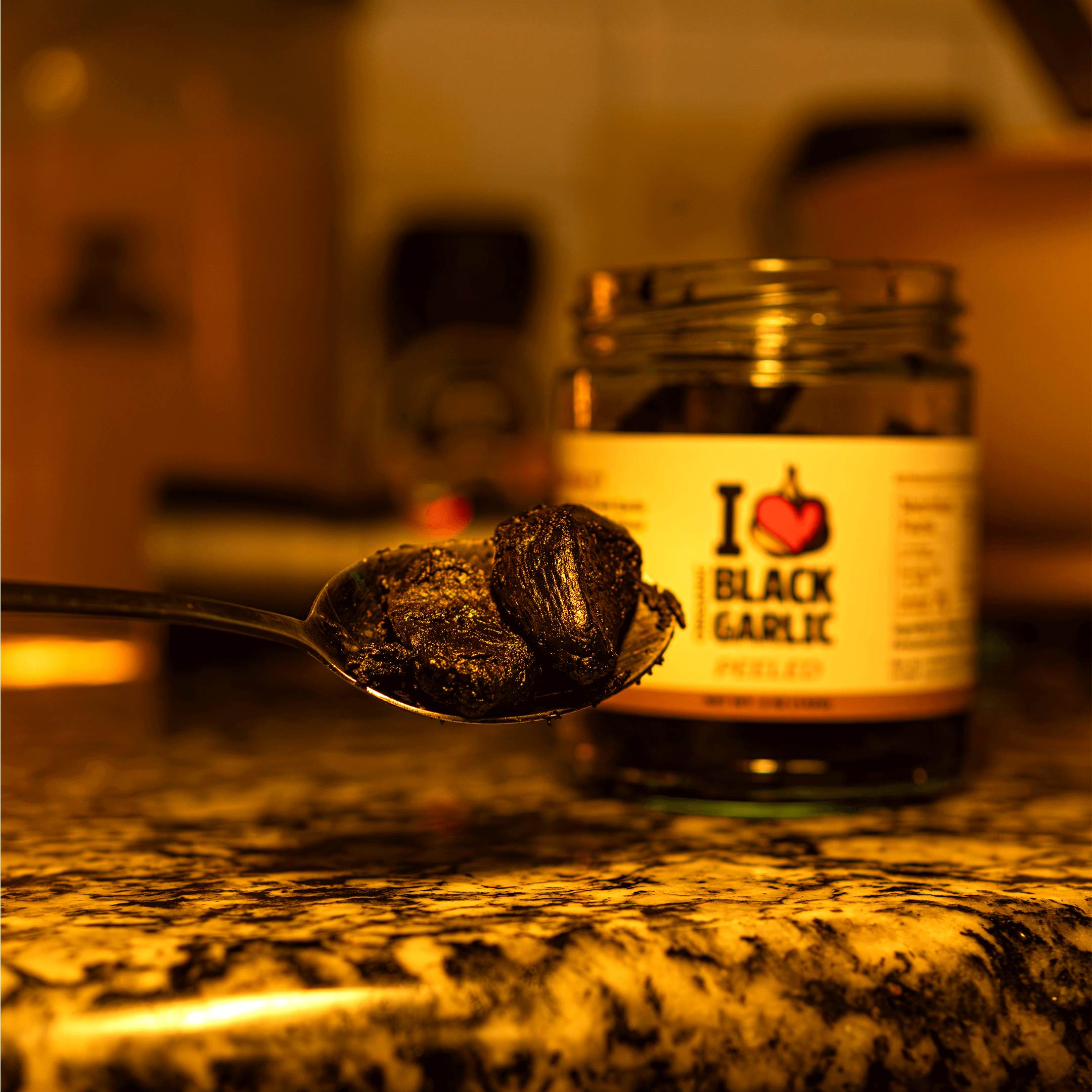 Spoon holding Organic Peeled Black Garlic Cloves – 5 oz | Ready-to-Eat | Sweet Umami Flavor | Vegan & USA-Made