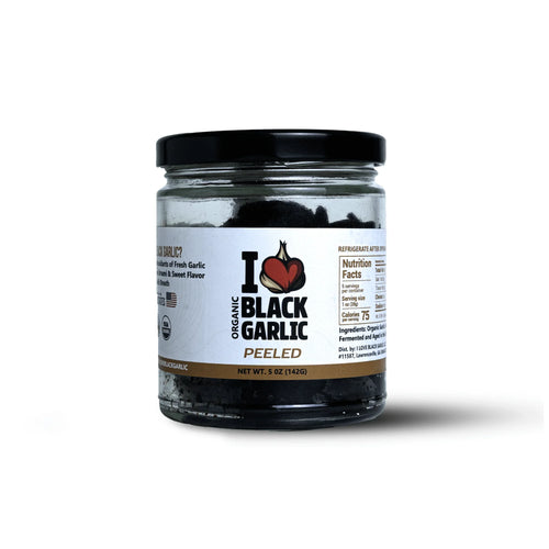 Jar of organic Peeled Black Garlic cloves 5 oz, showing label and nutrition facts, ready to eat for vegan and flavor lovers.